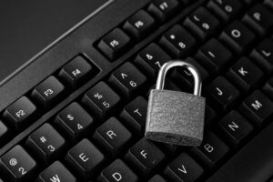 A high angle shot of a lock on a blcookies web b2b onlineack computer keyboard